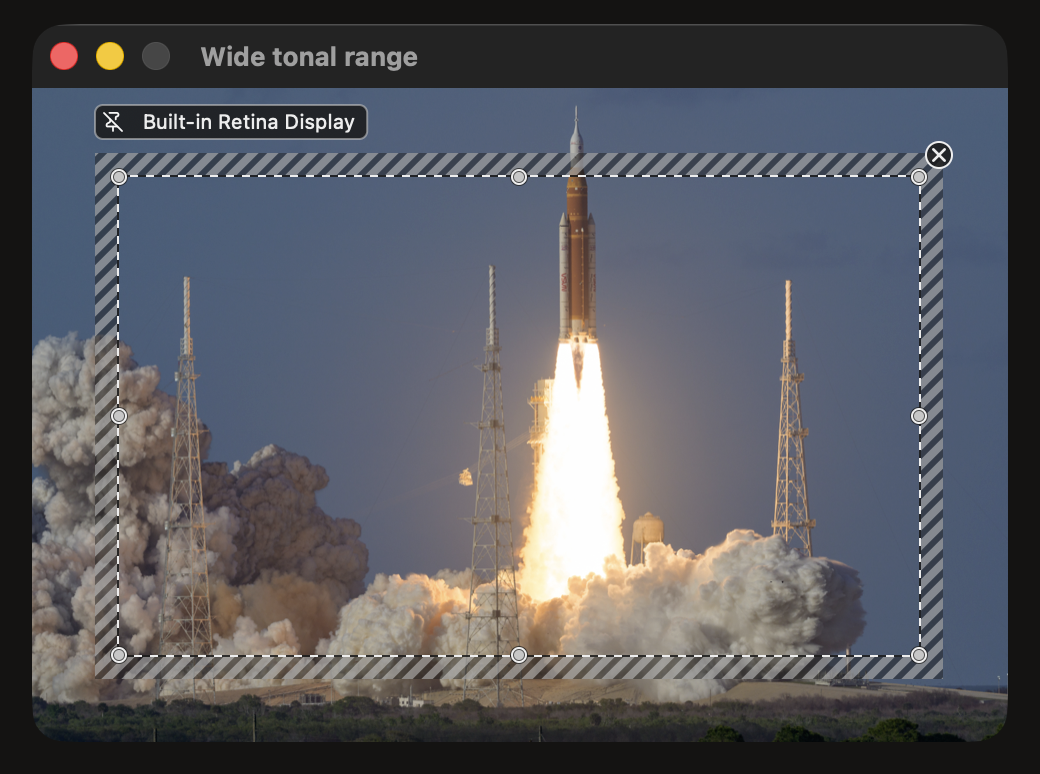 A fixed SideScopes region over a sample image, outlined by the striped editing band and labeled with the display name.
